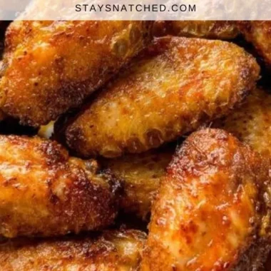 Crispy dry rub chicken wings served in a bowl, garnished with parsley.