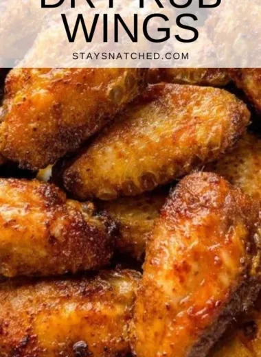 Crispy dry rub chicken wings served in a bowl, garnished with parsley.