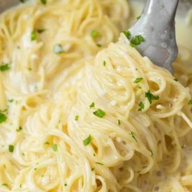 Creamy Garlic Parmesan Pasta garnished with parsley in a bowl