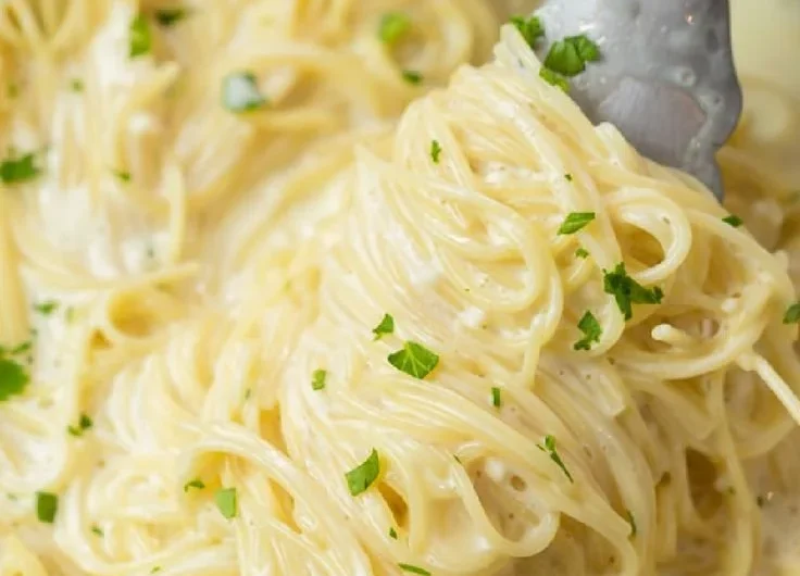 Creamy Garlic Parmesan Pasta garnished with parsley in a bowl