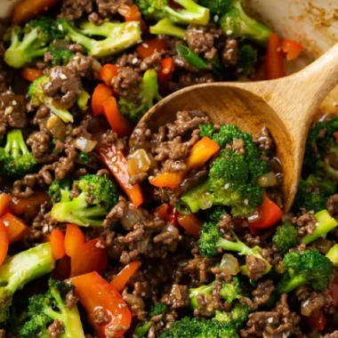 Ground beef and broccoli stir-fry served in a bowl with rice