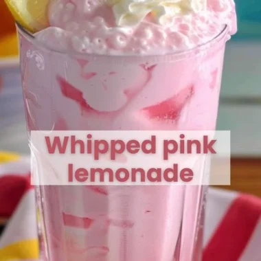 Delicious strawberries and cream lemonade served in a glass with fresh strawberries