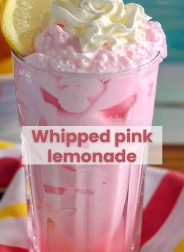 Delicious strawberries and cream lemonade served in a glass with fresh strawberries