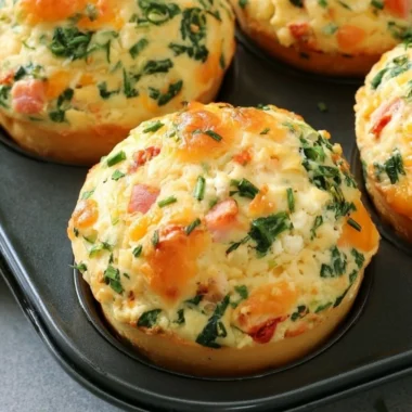 Delicious homemade breakfast protein biscuits stacked on a plate.