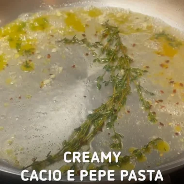 Cacio and Pepper pasta dish with a unique twist garnished with herbs.
