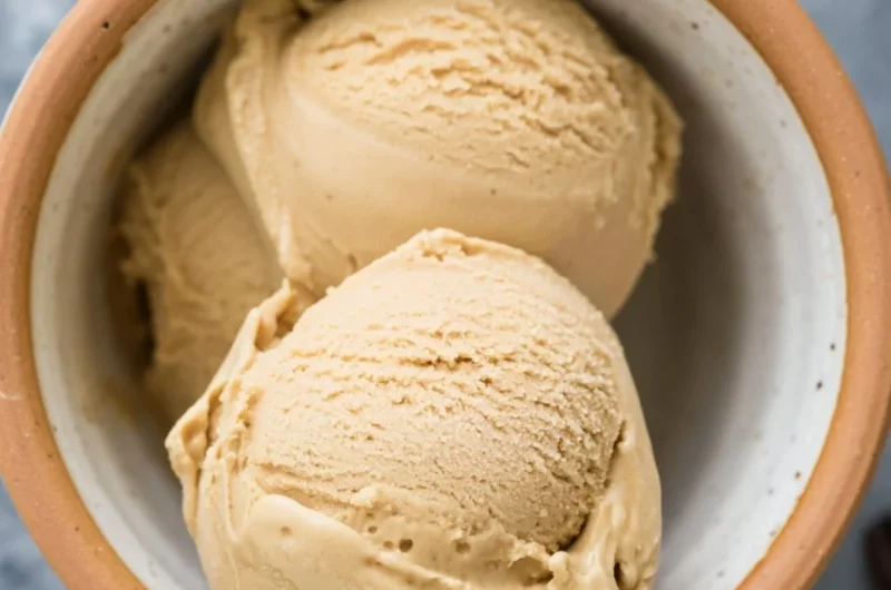 Delicious bowl of coffee ice cream topped with chocolate shavings.