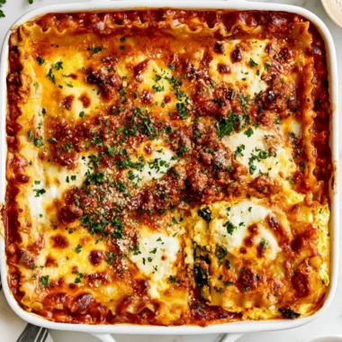 Delicious cottage cheese lasagna served on a plate with herbs and cheese
