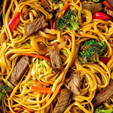 Cozy beef stir fry served with linguini and colorful vegetables