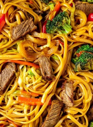 Cozy beef stir fry served with linguini and colorful vegetables