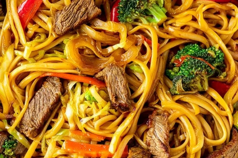 Cozy beef stir fry served with linguini and colorful vegetables