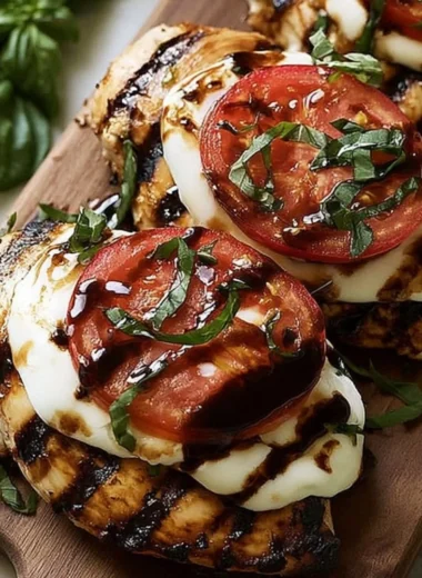Delicious Easy Grilled Chicken Caprese topped with fresh basil and mozzarella