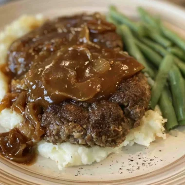 Delicious easy Salisbury steak served with rich gravy on a plate