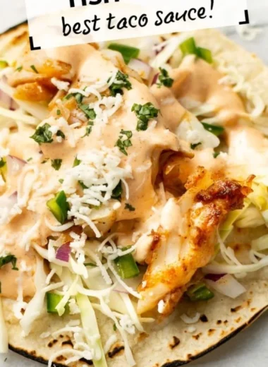 Plate of vibrant fish tacos topped with fresh cilantro and lime