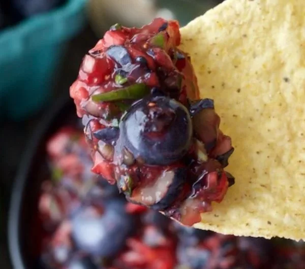 Fresh fruit blueberry salsa blended with vibrant berries and spices