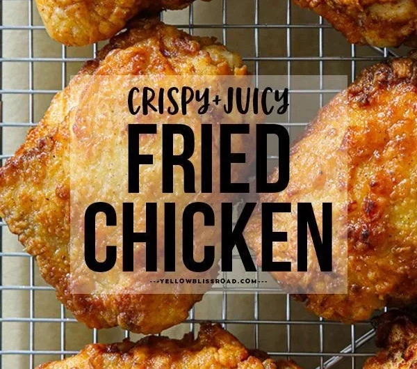 Crispy fried chicken thighs served with dipping sauce and herbs.