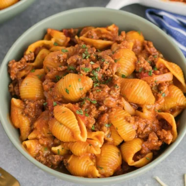 High protein taco pasta served in a bowl with fresh toppings
