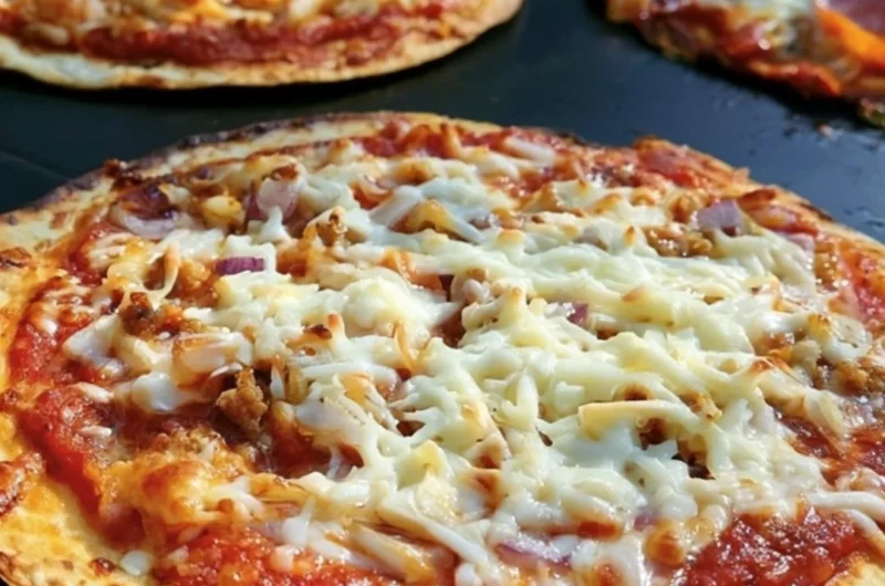 Delicious homemade griddle pizza cooked to perfection on a stovetop griddle.