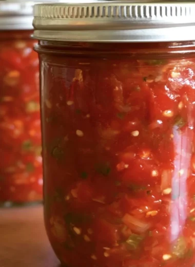 Bowl of fresh homemade salsa with vibrant tomatoes and herbs