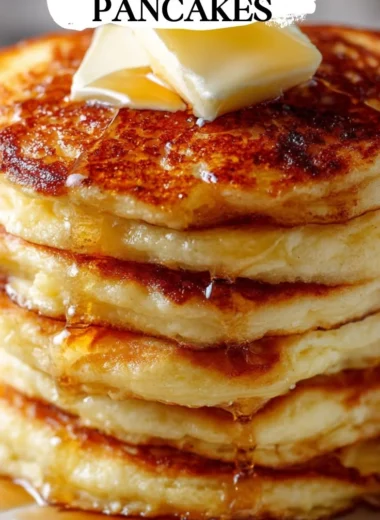 Fluffy old-fashioned pancakes served with syrup and fresh berries