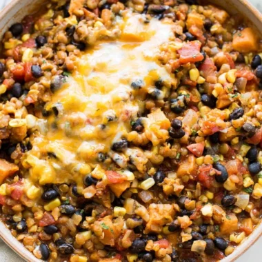 A bowl of One Pot Mexican Lentils garnished with fresh cilantro and lime.