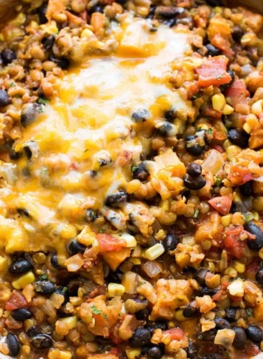 A bowl of One Pot Mexican Lentils garnished with fresh cilantro and lime.