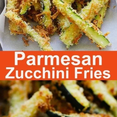 Crispy Parmesan Zucchini Fries served on a plate, garnished with herbs.