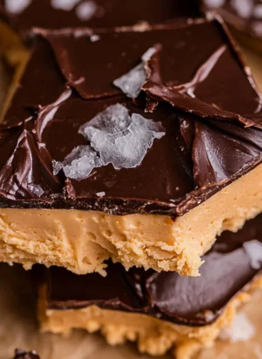Peanut butter chocolate Greek yogurt bark with nuts and chocolate drizzle