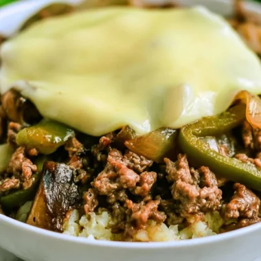 Philly cheesesteak bowl with peppers, onions, and cheese