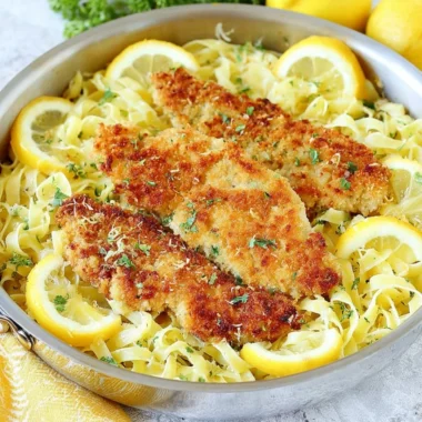 Plate of Romano Chicken served with Lemon Garlic Pasta