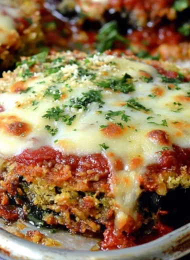 Sheet Pan Eggplant Parmesan with layers of cheese and sauce on a baking sheet