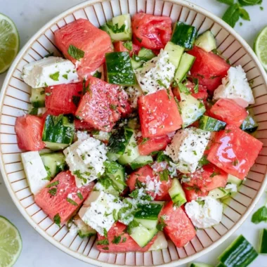 Refreshing watermelon cucumber salad with feta cheese in a bowl.