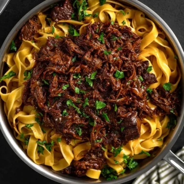 Delicious slow-cooked short rib ragù served with pasta