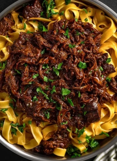 Delicious slow-cooked short rib ragù served with pasta
