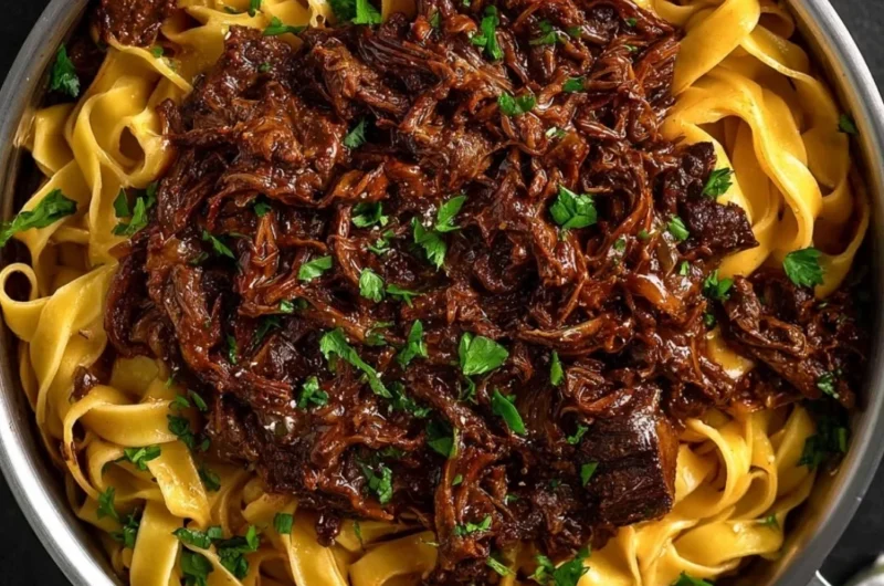 Delicious slow-cooked short rib ragù served with pasta