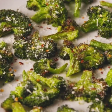 A plate of delicious smashed broccoli with olive oil and spices.