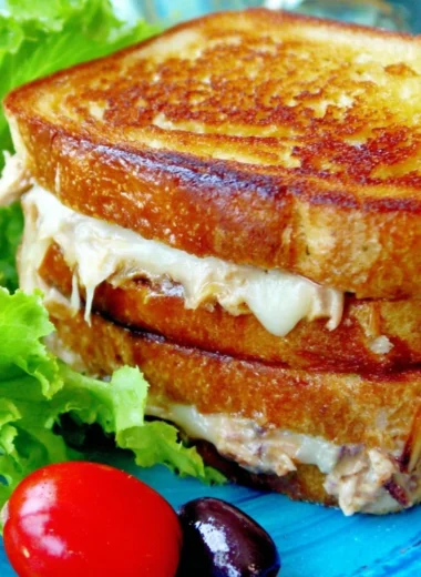 A delicious, gooey tuna melt sandwich on a plate