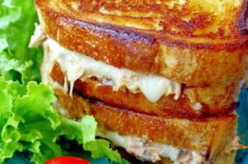 A delicious, gooey tuna melt sandwich on a plate