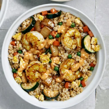 Delicious Hibachi Shrimp Rice Bowl topped with fresh vegetables and savory sauce