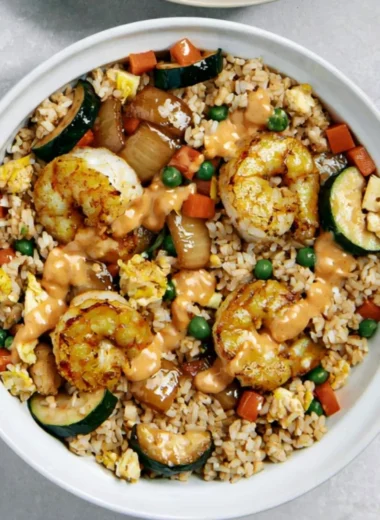 Delicious Hibachi Shrimp Rice Bowl topped with fresh vegetables and savory sauce
