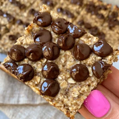 Delicious homemade banana bread oatmeal bars on a wooden board