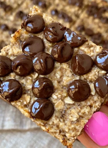 Delicious homemade banana bread oatmeal bars on a wooden board