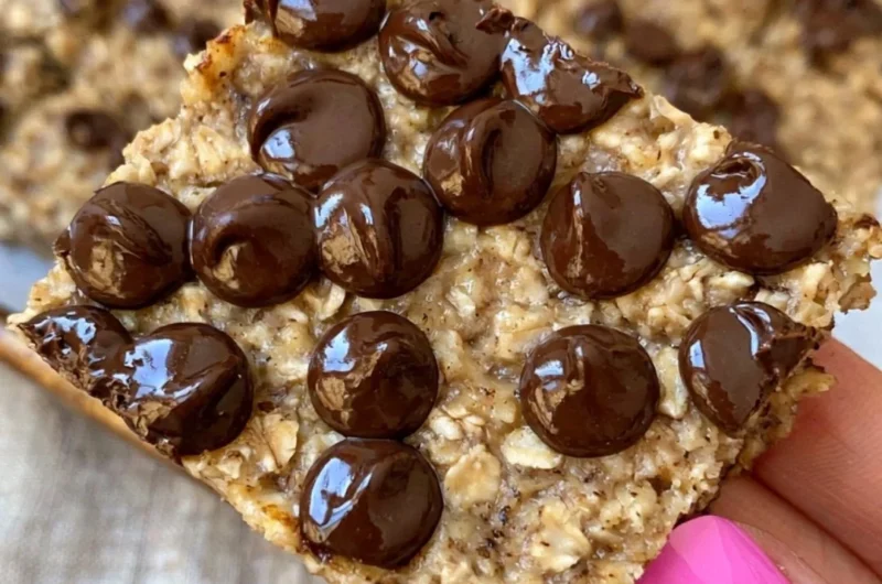Delicious homemade banana bread oatmeal bars on a wooden board