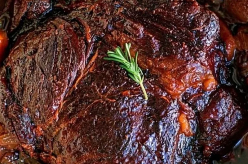 Deliciously cooked beef chuck roast served with vegetables and seasoning.