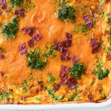 Broccoli Cheddar Egg Bake with Turkey Bacon on a plate