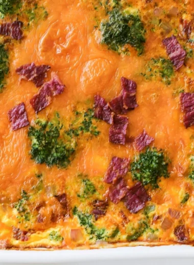 Broccoli Cheddar Egg Bake with Turkey Bacon on a plate