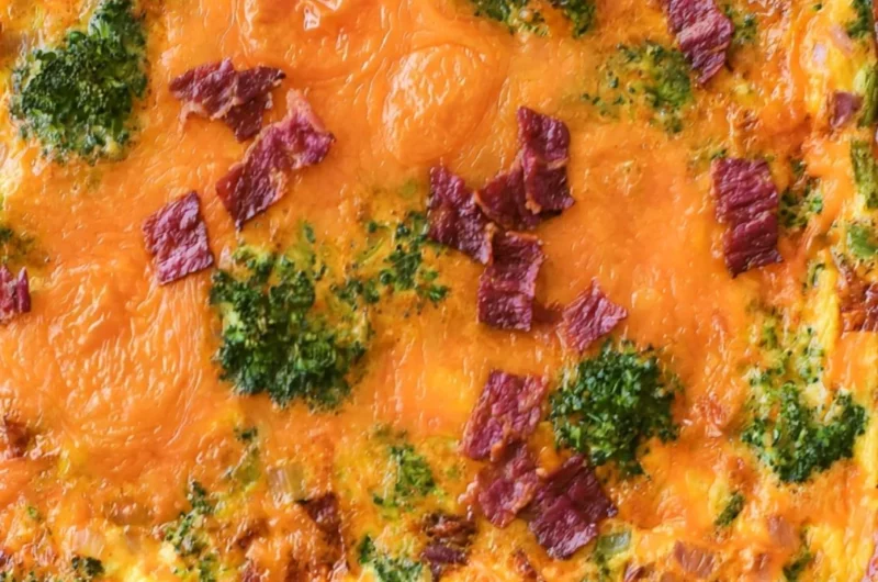 Broccoli Cheddar Egg Bake with Turkey Bacon on a plate