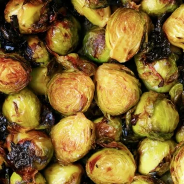 Cozy Brussels sprouts drizzled with balsamic glaze on a plate