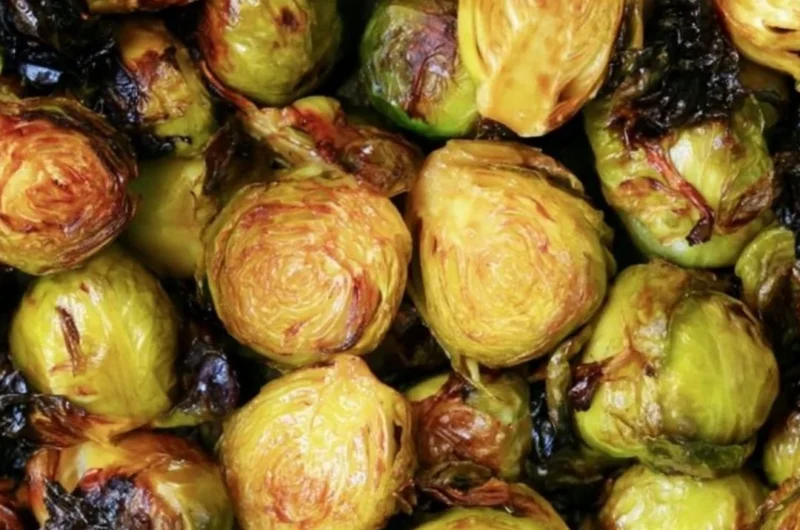 Cozy Brussels sprouts drizzled with balsamic glaze on a plate