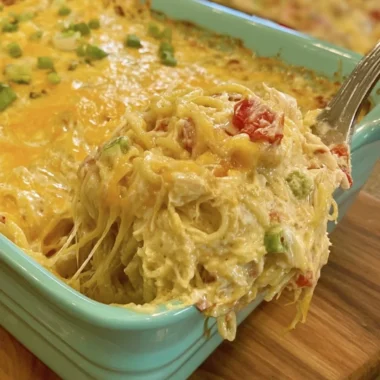 Cozy chicken spaghetti with Rotel and Velveeta in a bowl garnished with herbs