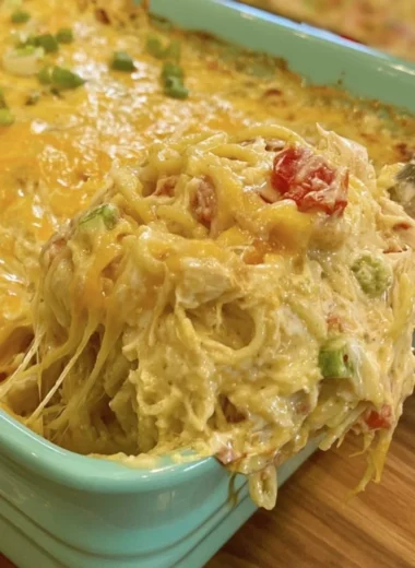 Cozy chicken spaghetti with Rotel and Velveeta in a bowl garnished with herbs